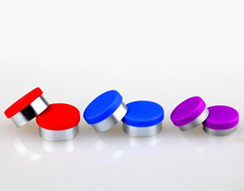 Glass bottle with aluminum cover and rubber stopper